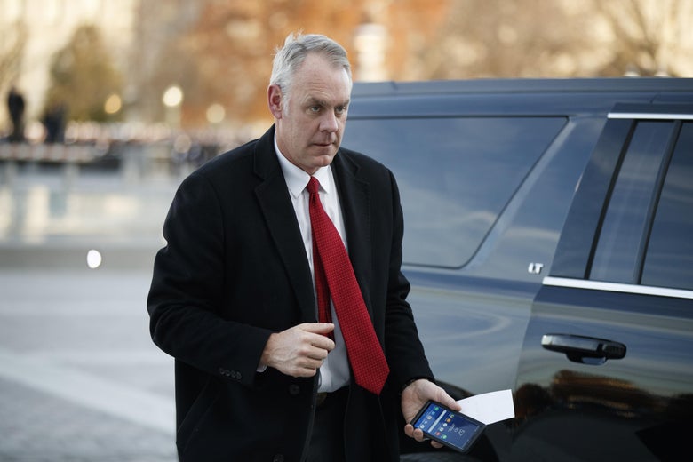 Ryan Zinke exits a car to arrive at the US Capitol on December 03, 2018.